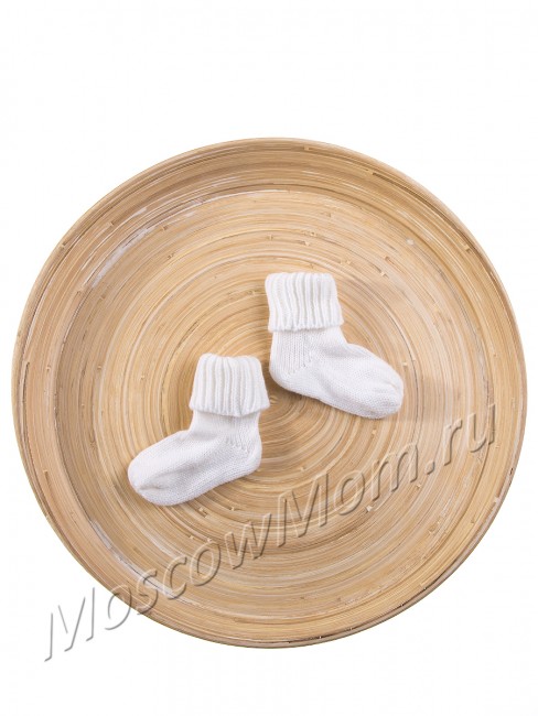 Белые вязаные носочки для новорожденных